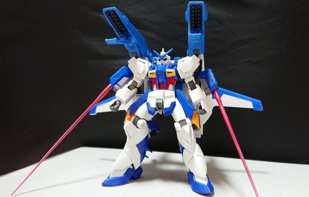 機体名：Gムラサメ・サード
機体のコンセプトを１度変更するべく攻撃特化型にさせた姿。

[武装]アームド・アーム×２、頭部バルカン、胸部バルカン、拡散ミサイル28基(112発)、ロング・ライフル、となっている。

[総合スペック]1.0～13.0の内
8.0と判断。

アームド・アームはビームサーベル以外にビームスプレーガンと同等の威力のビームを２点バーストで撃てる。
しかし低火力な
為射撃を避けずに突っ込んでくる敵がいる上当たってもかすり傷１つ付かない相手もいる。
又ビームサーベル同士を当てて円状のビームを射出可能(VSシリーズのユニコーンとほぼ同じ現象)
拡散ミサイルは２８基の内１基に４弾もの小型のミサイルが積んである、決め手にはならないが広範囲でかつ使い道が広く目眩ましや敵を同様させたり誘導させる為等に使用する。
ロング・ライフルは照射しかしないように改修しており自分の手に持たずGディフェンサーに付けたまま敵に銃口を向け撃っている、直撃する確率は機体に不慣れだった頃は１０%未満だったが最近だと６発に１発は当たるようになっている。
とは言っても立て続けに撃てない為こちらもほぼ敵の誘導に使っている。

戦果
幾度となく敵の足止めに成功。
無数のバグ&オッゴの撃破に貢献。

黒いウイングに妨害を受ける(黒いウイングは後に紹介予定)
黒地客と遭遇し右肩が潰され左足を破壊される(黒地客は後に紹介予定)
ProtoWayne(プロトウェイン)達との戦闘において中破&戦闘不能になる(プロトウェインは後に紹介予定)