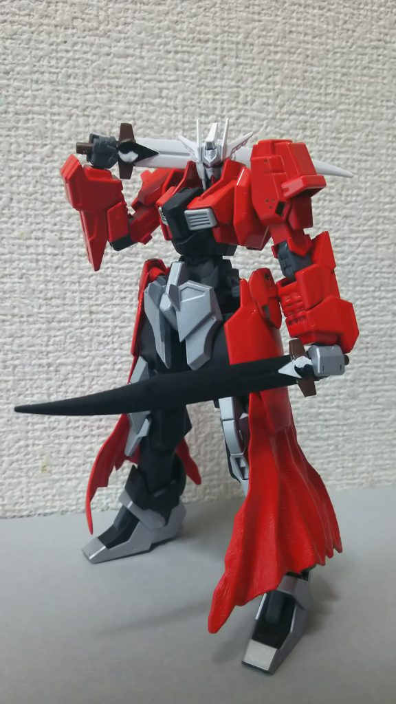 全7シリーズあるうちのひとつ、弓兵の魂を持つ機体──【ガンダム・アーチャー】は主に中・遠距離戦闘に特化したガンダムであるが、この【TYPE-UBW】はその中でも異質な存在である。ガンダムは組み込む英霊によってそのステータスや宝具が変わってくる。この【TYPE-UBW】も遠距離タイプの機体通り、弓矢型の武器を使用はするのだが、驚く事に弓矢はあまり使わず、メインは2振りの夫婦剣を使用するという、弓兵型にしては変わったガンダムなのである。また、宿っている英霊が特殊なのか武器が破壊されてもすぐに修復または無尽蔵に召喚されるという謎の能力も秘めている。