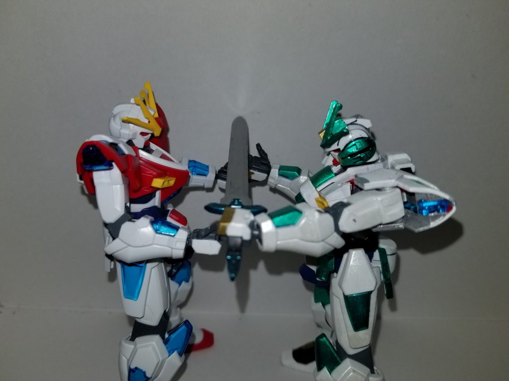 ストラトス唯一の武器だった剣を手渡す方式での継承式です。ストラトスの左肩が上がっているのは剣の部分をイングヴァルトの平手に乗せているからなんとか左腕が上がっています。