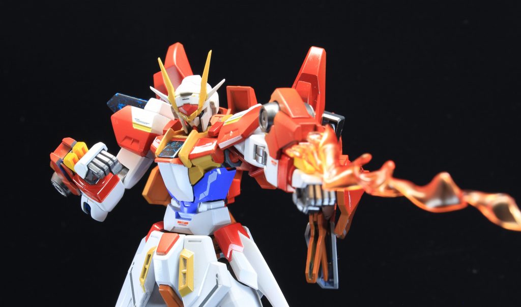 腕部には新装備「バーニングドライブ」を装備している。
GN粒子をバーニングドライブ内で変換、近距離の打撃時もさることながら 中距離の敵に対しては粒子ビームを放つことができる。