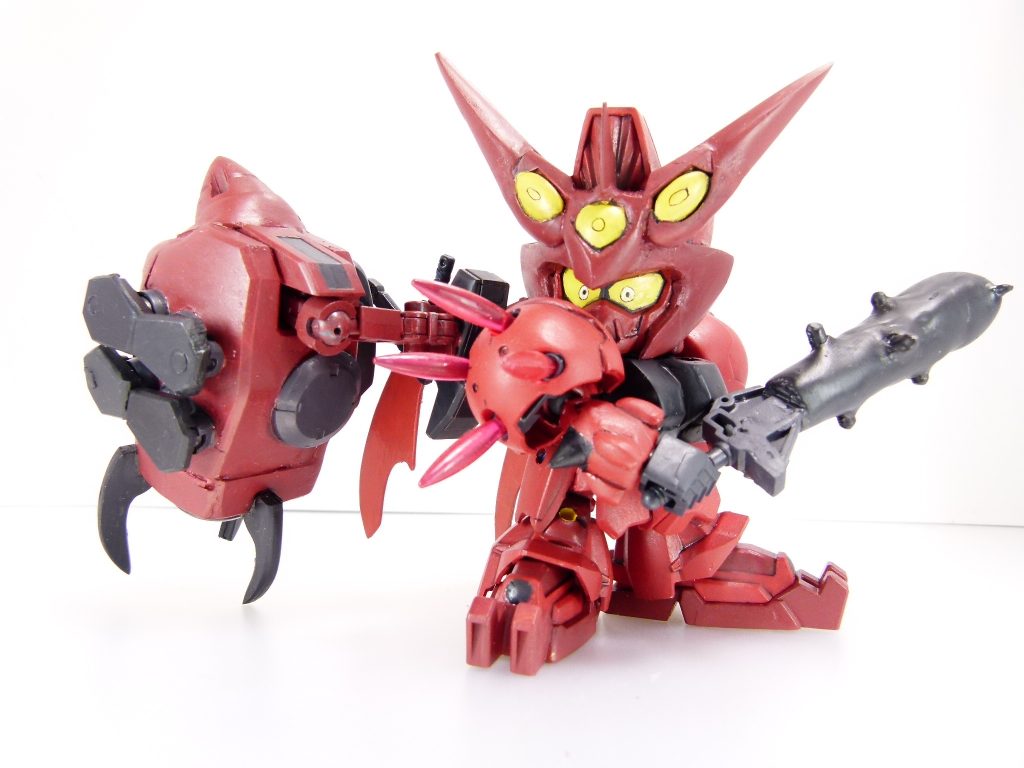 ビームニードルストレート：前身機から引き続き採用（本作ではオミット）。腕先端に装備された叩打武装。リクとのトランザム対決の時に使用を確認。ビームショルダータックル：こちらも前身機から。設定上本機が搭載しているかどうかは不明であるがタイタスベースだったのでつい･･･肩はタイタスの肩を肩アーマー代わりに素体にかぶせています。腕の増加部分はパテとプラスプリング、RGザクIIのスパイクで作成。手は元キットと変わりなし（角度が付けられる！）。左平手は呂布からです。胸部は孫策の形状と実際のGP02の形状が違うためそのあたりをパテで軽く成形。