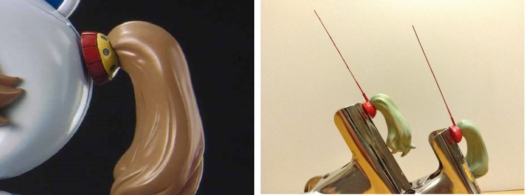 ギャン子のツインテールには写真左のようなギャンの盾をモチーフにした髪飾りが付いてます。
ここに真鍮線とパイプで作ったアンテナを付け、全体を赤く塗ってザブングルらしさを狙ってみました。