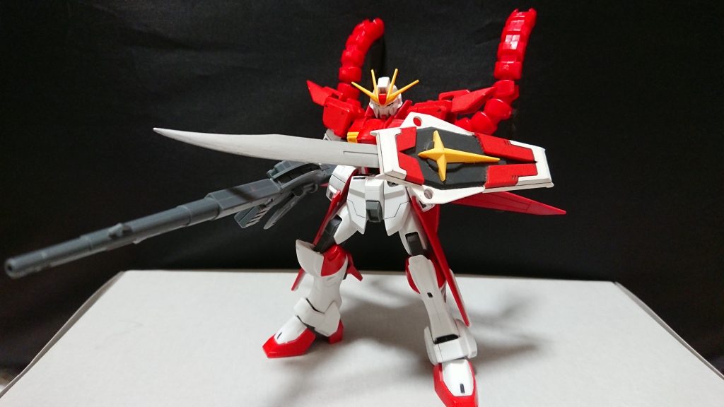 機体名：レッドインパルス・セカンド

[追加武装]シールド(ヒート)ソード、バスターランチャー、イーグルパック、となっている。

[総合スペック]1.0～13.0の内。
7.5と断定。

機体本体は胴体の分離速度上昇、エネルギーの増加等に成功しイーグルパックを装備した事によって機動力が上昇し可変機にもなった。
イーグルパックにはエクツァーン×２が搭載されていて且つイーグルパックを射出し遠隔操作も可能となっている。
(イーグルパックは射出後再度装着する事は可能ではあるが成功した試しがない)

右手(後に頭部)に膨大なエネルギーを蓄えていて自ら使用するビーム兵器の粒子を調整する事が出来るようになっている、その為ビームサーベルを細くする代わりにリーチを伸ばしたり反動のでかい高出力なビーム兵器の威力を押さえて発射する事が出来る(威力を押さえて発射してもエネルギーの消費量は同じ)。

元来少年が思い描いていたレッドインパルスの姿、この形態を実現出来た事で本格的に対人戦をするようになった。
(体を分離した戦法を得意とする)
名にセカンドと付けてはいるが変わらずレッドインパルスと呼んでいる。

戦果...。
多数のMS撃破。
カオス・ヴァルターを中破。
黒いウイングの撃破に貢献。