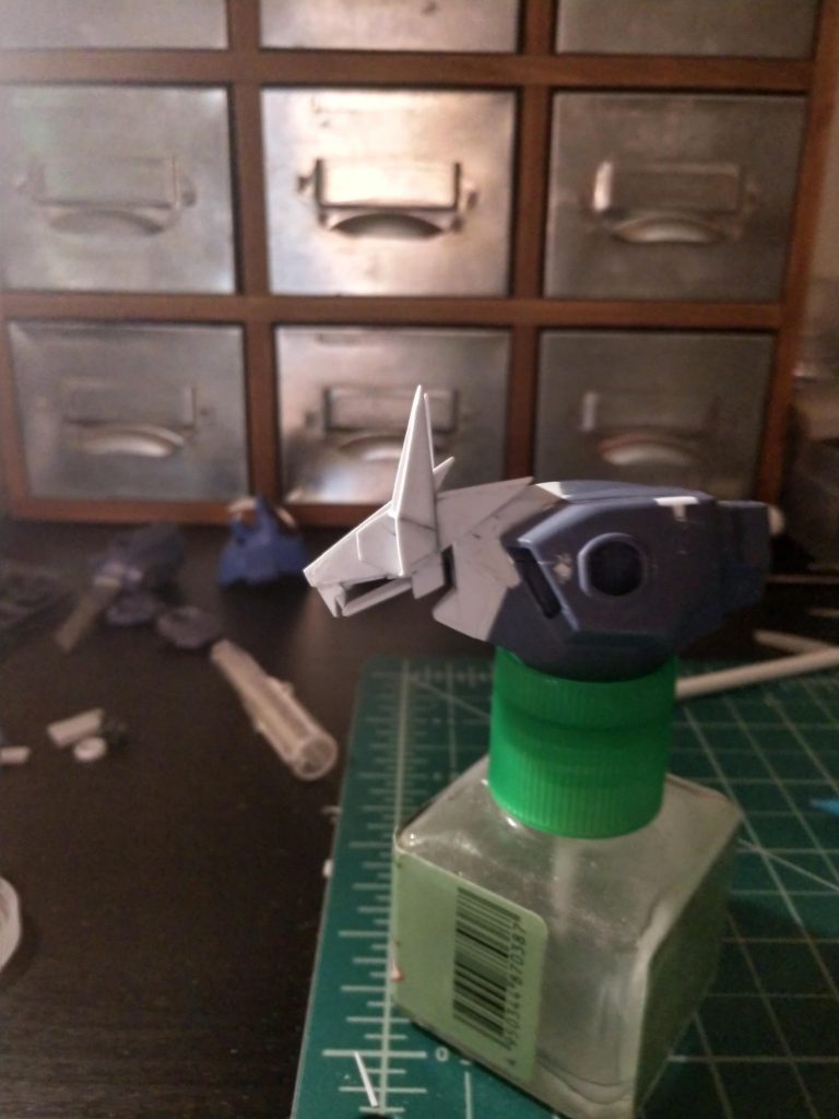 Neck was elongated, and a new head was mounted on a ball joint along with ears and a movable jaw.