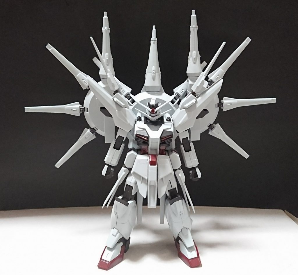 機体名：プロヴィデンス・ハイエンド

[武装]頭部バルカン、胸部バルカン、ドラグーンシステム×19[小型ドラグーン×12、中型ドラグーン×4、大型ドラグーン、次世代大型ドラグーン×２(GDU-X7突撃ビーム機動砲)]、改修型複合兵装防盾システム、特殊刀、???、となっている。

[総合スペック]1.0～13.0の内。
11.5～12.3と想定。


人間が完璧に使いこなすのは難しい(ほぼ不可能)とされる機体。

機体の装甲を削っていく特殊な粒子を内蔵しそれを操れるよう武装共々改修が施されている。

機体の機動力は並のMS以上ではあるが決して突出してる訳ではない。
ドラグーンは計19基あり改修型複合兵装防盾システムは遠隔操作が可能な為約20もの遠隔操作が可能な武装を有している、総砲門数は59門(防盾システムを含めると62門)。

 改修型複合兵装防盾システムは通常のものとは違い左前腕部から射出し一時的な遠隔操作が可能となっている(ビームサーベルしか展開出来ない)。

その他防盾システムに特殊刀を付与させる事で防盾システムに内蔵されているビーム兵器は全てより高出力な状態に出来る、特に高出力ビームサーベルは特殊刀の影響を多く受け超高出力ビームサーベルとして展開される(特殊刀を付与したビームサーベルは特殊刀と同じ装甲を削る能力も受け継がれる)。