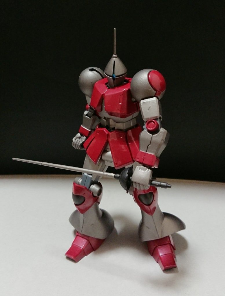 機体名：ギャン

[総合スペック]1.0～13.0の内。
5.5と想定。

少し装甲が厚くなり熱えの耐性を高めたギャン、フェンシングスタイルで戦う。

バーストサーベルのみを装備しているのだが、替えの刃が無い為本来の性能を発揮出来ていない。
しかしギャンの操縦者はあえて替刃を用意していなかった、戦う相手を予め決めていたからだ。

ギャンの操縦者は教師を務める細身の中年男性で周り(学校関係者、近隣住民等)から心優しく寛容で親しみやすい人物であると評判なのだが、本性は優しさの欠片も無く実力主義者で物事を結果でしか判断しない上非常に差別的な性格だ。
何らかの形(スポーツ、GBN等)で戦う相手は戦意を失うまで笑顔で貶し続けられたりする事も多く、彼を敵視する者達はとことん彼を嫌い憎んでいる。
彼(教師)の本性や悪行を知る人は学園内にも少なからずいるが、その事を学校関係者に相談した所で到底信じてもらえない、それどころか嘘をついていると疑われるケースもあった。

彼がGBNを始めたきっかけは私生活で偶然が重なったからであり元々ガンプラやGBNに何ら興味を抱いてはいなかった。
知人にギャンの制作を頼み、完成するまでの間はガンダムやGBNの事を時間がある限り調べ続けていた。