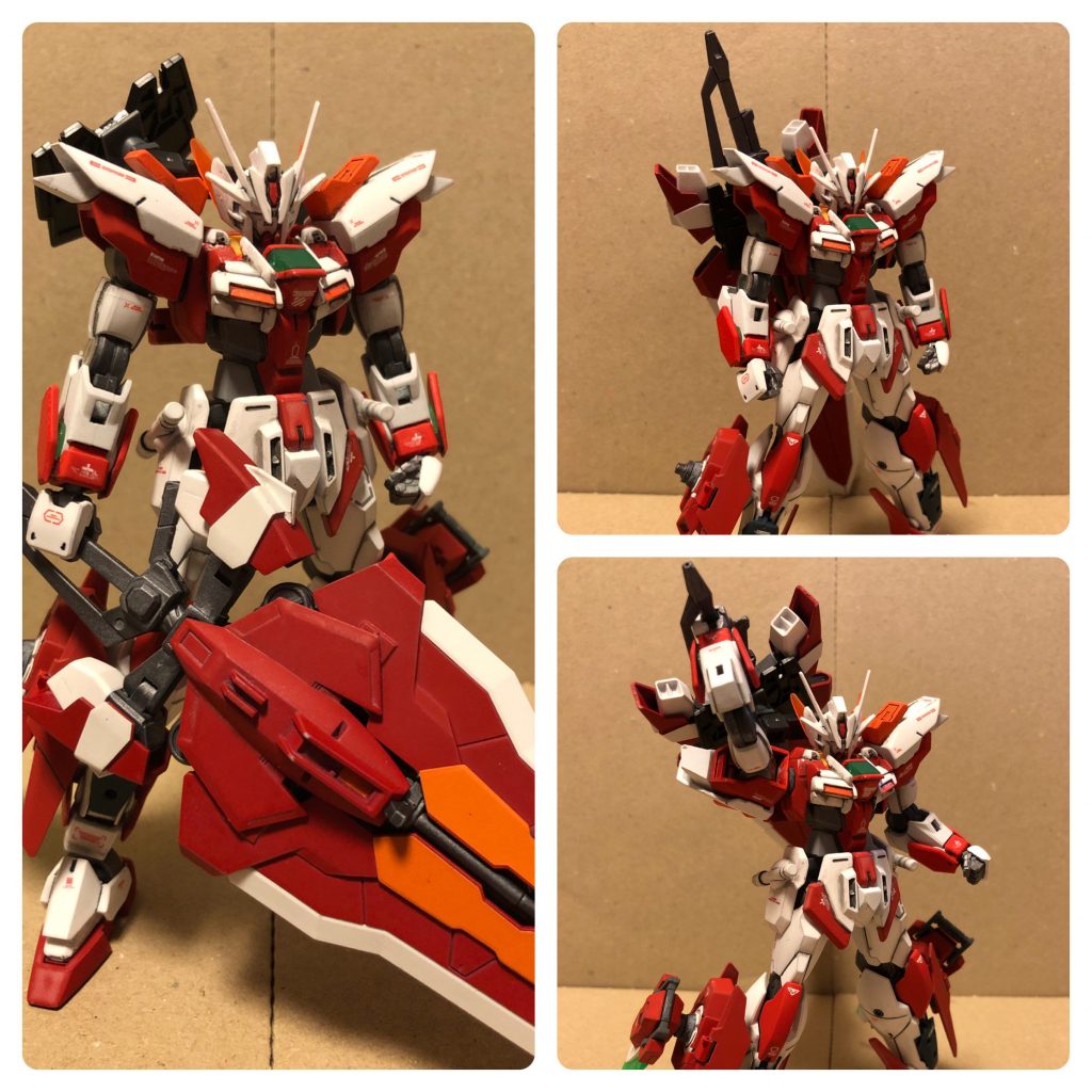 特殊兵装装備状態。巨大なタクティカルアームズを後ろに懸架するためにバックパックのGNドライブユニットを外し、代わりに両脚部サイドのハードポイントにGNドライブユニットを装備した状態。このように使用するオプション装備に合わせて、GNドライブユニットの配置を変更することも可能となっている。これを利用すると、バックパックに2基、両脚部サイドに2基の4つのGNドライブユニットを装備することも可能である。ただし、クアッドドライブは原典となる『機動戦士ガンダム00』の世界でも実現されていないことから、4基のGNドライブのシンクロというのは不可能と考えられるので、ツインドライブ×2という『ダブルツインドライブ』というシステムを裏ワザとして利用できる(笑)