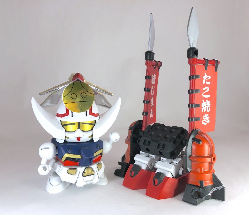 現代日本大阪では凄腕たこ焼き屋のおっちゃんな武ちゃ丸
鎧はモビルたこ焼き機として商売道具となります