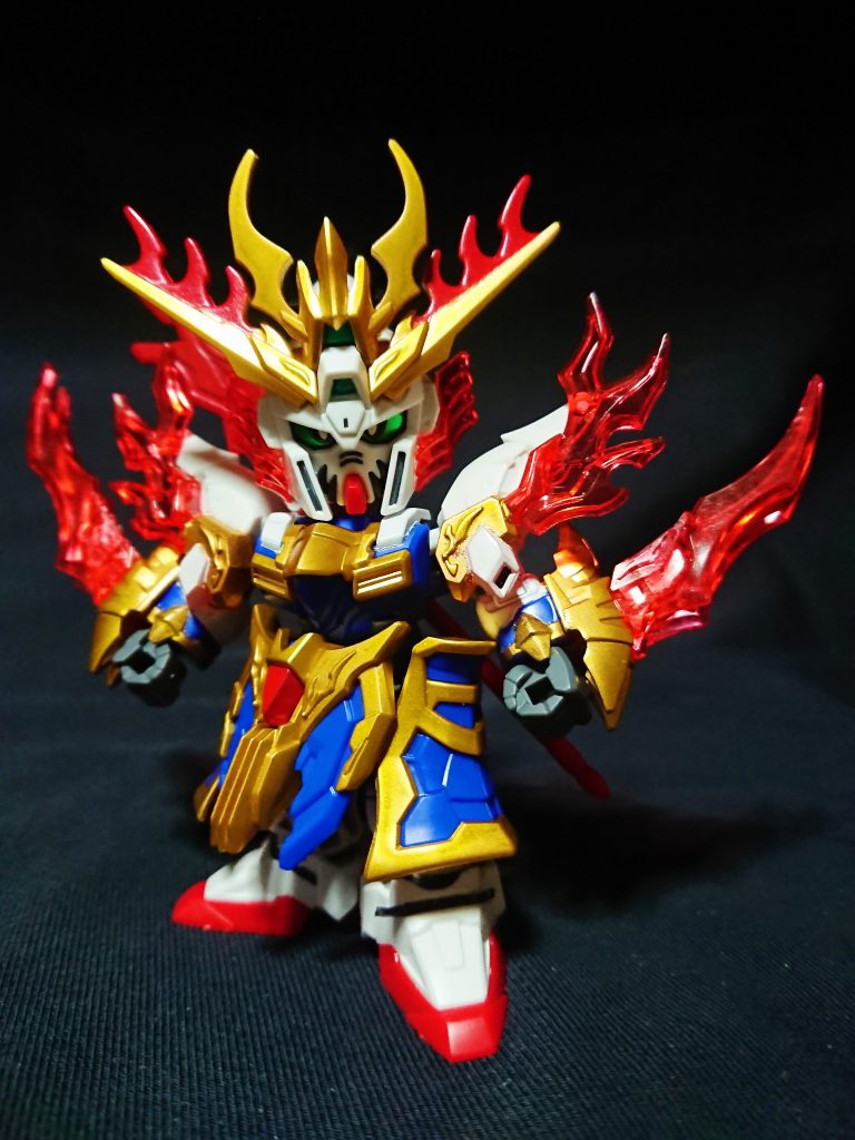 関羽と共にショク・エリアを目指しラクヨウを飛び出した。
近距離戦の得意な張飛は蛇矛を投げて使用することが多く、必殺の爆熱炎翔拳はエネルギーを両手に纏い打撃を打ち込む。