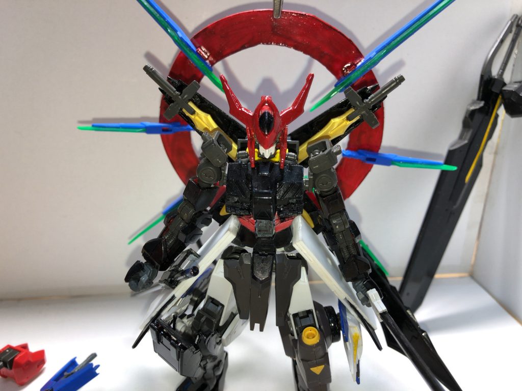 ''死''という結果を認めないコラスィは自ら封じていた''切り札''を発動させる   その''切り札''というのが右肩に装備していたシールドを背面に接続し、ビットを円型に対照的に配置  
リアクター出力、シールド内の太陽炉の粒子放出量を最大にし、ビットでそれらを合成した輪状の光  これをコラスィは自ら｢ドロモス(ギリシャ語で｢恐怖｣の意)｣と称した

｢ドロモス｣を発動したコラスィはバルバトスの暴走と量子化を併用した戦法で残りの地上部隊を壊滅状態に陥れた