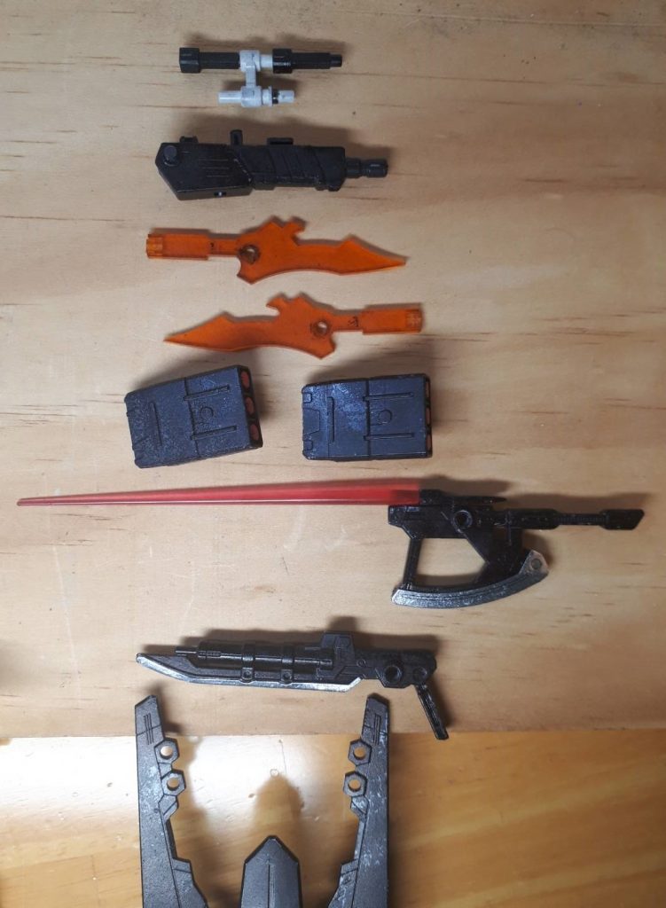 *4. 兵装解説2 (外装・バックパック部)
 4-1 GN直列式ビームガン(センサーユニット付き)*
  基本的にはセルべロスのものと変わらないがセンサーユニットの追加により
命中精度の向上を図ったもの。
*4-2 大型NGNグレネードランチャー*
   バックパック、しっぽ部分の兵装。セルべロスのものと同じである。
*4-3 準万能兵装 ルーラレア*
   実体剣、ビームサーベル兼ビームガンの機能を持つ複合兵装。ビットとしても使用できるがその時の機能は打突のみである。今後、他のルーラレアシリーズに置き換わる予定である。
*4-4 複合兵装 GNミサイルシールド*
ミサイル・加速装置・シールドとしても使える兵装。以下二つと合体可能。
*4-5 準万能兵装 GNアックスサーベル*
   ビームライフル・サーベル、アックスとしての機能を持つ兵装。GNミサイル
シールドと合体することによりビーム・実体剣、ビーム・実体弾、4種類を一
つで網羅した万能兵装となる。
*4-6 複合兵装 GNサーベルライフル*
   サーベルとビームライフルとしての機能を持つ。GNミサイルシールドと合体
することが可能。
*4-7 GNクロー*
  ハードポイント化しているためあまりクローとして有効活用はできない。
主翼の役割がメイン。