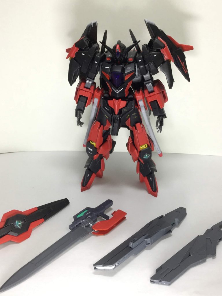 武器
GNソード エクシアのデータを元に作られた大型ソード
エクシアと違いライフルモードはオミットされている
GNシールド リボーンズガンダムと同様の物
変更点はファンネルではなく固定武装のライフル、展開してGNフィールドを張れる
GNバスターソード&バスターライフル
GN-XⅡの武装をもとに改良した武器
GNレールガン
腰部に追加装備。展開速度が速い為、緊急時等に使われる
ビームサーベル
両肩に1本ずつ装備