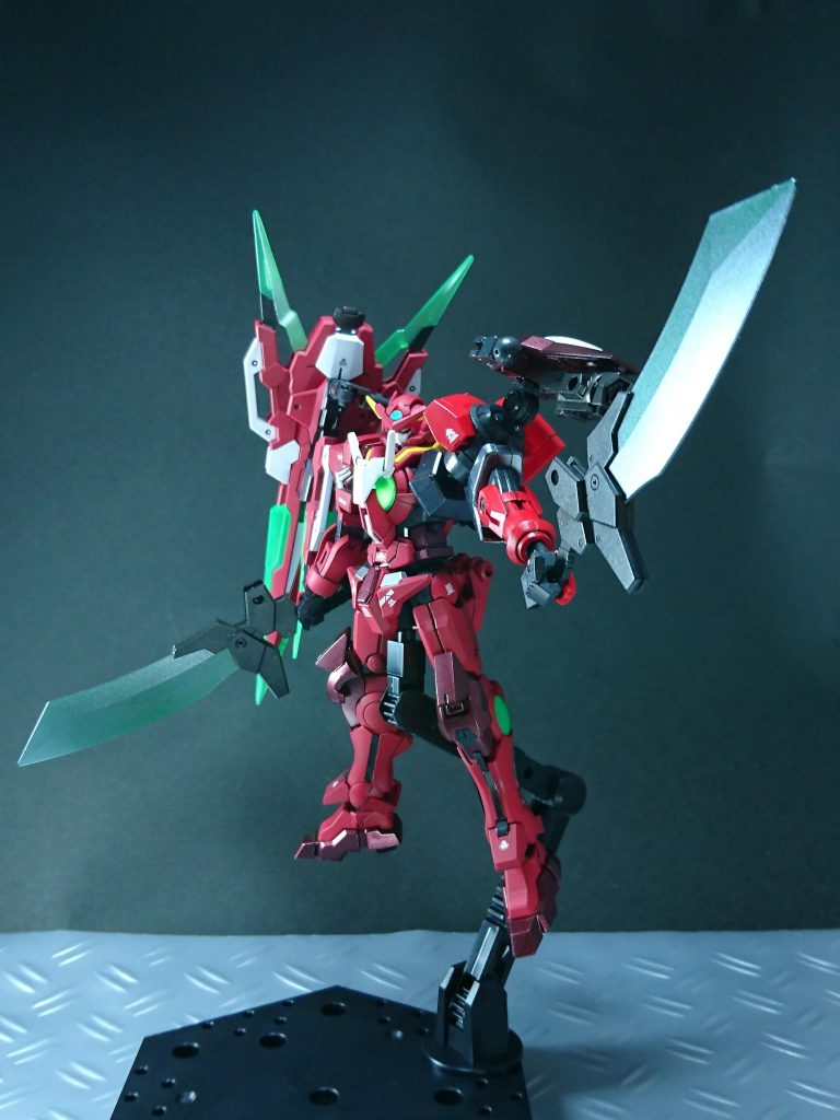 右腰背部に搭載している「GNナタ」はガンダムエクシアリペアⅣが装備しているGNタチと同様にGNソードⅥの開発過程で作られた武装である。GNソードVやGNタチと異なり刀身が短く幅広な作りになっており、取り回しに優れ強度も高いため防御にも使用できる。