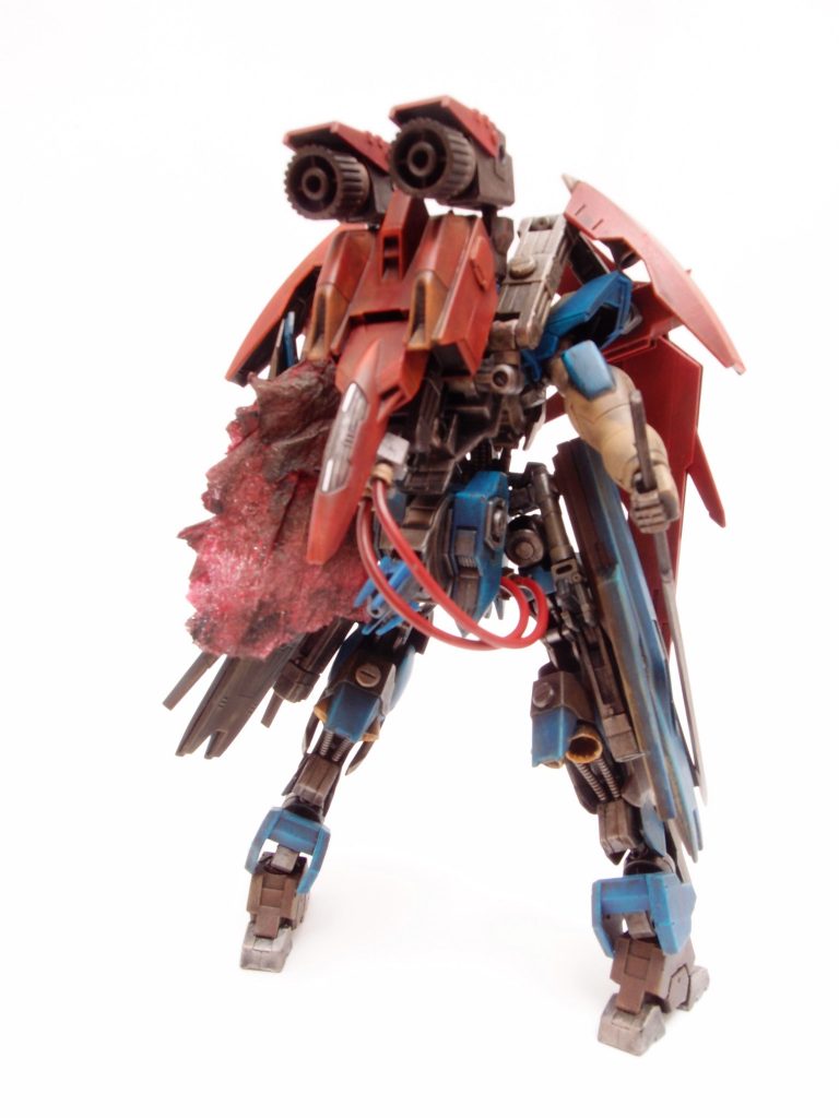 強大化するＭＡ勢力に対抗するため、ブルーキャラバンのリーダー機[*アースガルズ*](https://gumpla.jp/hg/110108)の支援機、ガルウイングを（無断で）分解、サブアームを利用して追加装甲兼スラスターとして強引に再構成したもの。