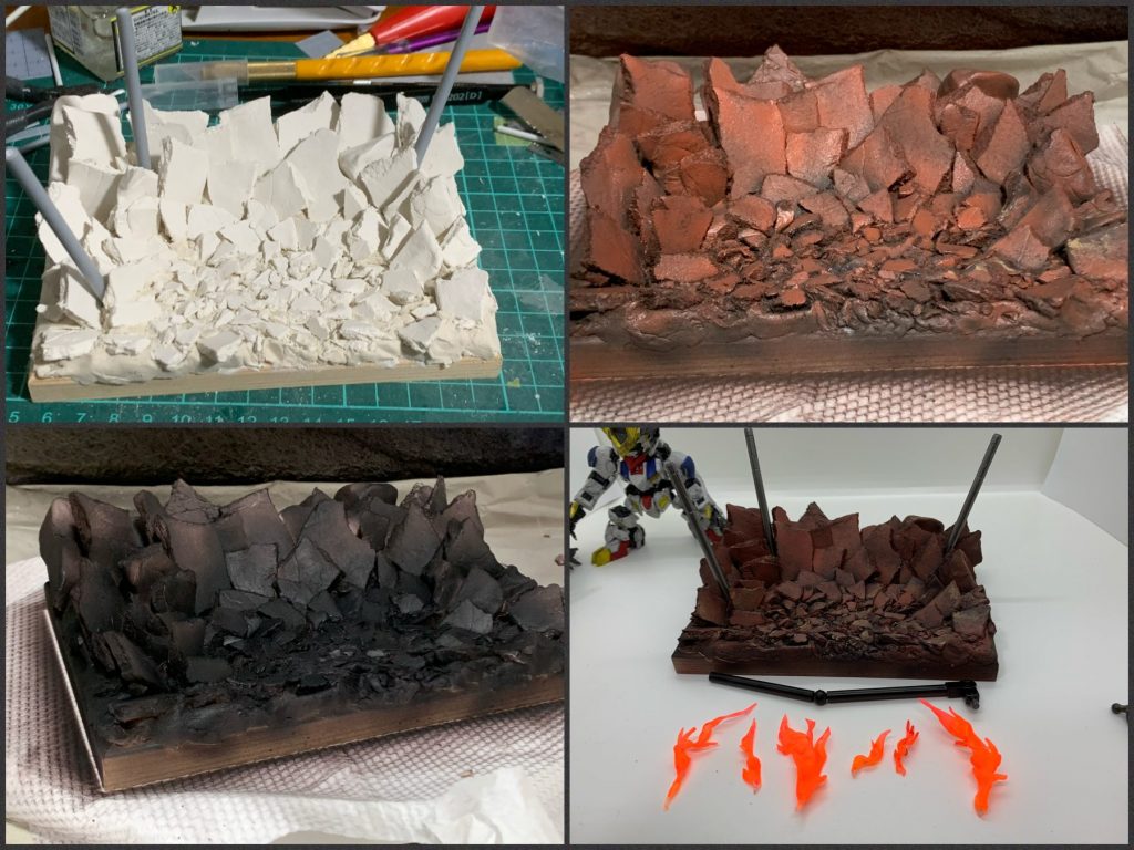 百円均一の木製フォトフレームの上に石粉粘土を盛って、その上に石粉粘土を板状にしてから砕いたものを配置しました。
ダインスレイヴ風の杭とアクションポーズ用の支持アームを4.5mm肉厚プラパイプで制作。アームの関節はホビーベース球体ジョイントとボールデン。
謎の火炎エフェクトは眼光エフェクトを作った時のボツや端切れプラ板から。アクリジョン 蛍光レッド、蛍光オレンジ、蛍光イエローで塗装。
仕上げに水性ホビーカラーのつや消しクリアをかけましたが、耐久性に難あり。
撮影中にも石粉粘土の表面の塗装剥げや盛り付けたカケラの剥がれが…😱
塗装剥げは白く目立つので、色付きの石粉粘土を使えば良かったかも…
## 改造
・角、爪等のシャープ化
・超巨大メイスの先端と後端をプラ棒に置き換えてシャープ化
・各種肉抜き穴埋め
・フロント&サイドアーマー独立可動化
・メイス持ち手のにぎり位置を調整
・CSフレームの股関節と腰関節をホビーベース球体ジョイントに置き換え、股関節は軸位置を少し上に移動
・全身にダメージ加工(デザインナイフ、金属やすり、リューター、ニッパー等を使用)