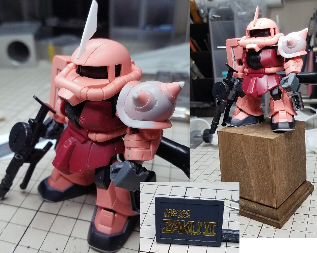 今回は誕プレ、ということで、
豪華な？台座も製作しました

50ｍｍ角のブロックに、
スジボリ堂さんの木製台座をセットして、
アサヒペンの水性ジェルステインで塗装しました
お手軽簡単で中々の質感…(*´∀｀*)

ネームプレートはプラバンにて、
内部の機体名は金のカッティングシートをプロッターで切ったものです