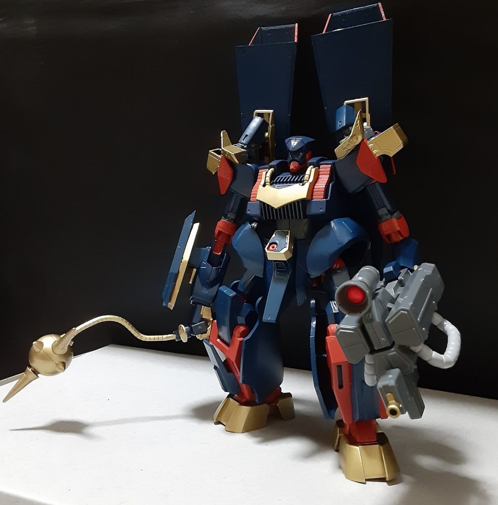 GBNに現れてはビルダーの乗る機体を攻撃してくるそうでビルダーが反撃の意思を示せば執拗に追跡し、自機かあるいは狙った機体が撃破されるまで(間髪いれずに)攻撃してくるらしい。
逆に反撃の意思を示さずすぐさま逃走を図れば追っては来ないそうだ。
操縦者、行動原理は共に不明でありGBNの運営は信頼のあるビルダーに協力を仰ぎ、共に機体の情報を集めるよう頼んだ。

調査から数週間が経ちわかった事はあの機体はとある少年が製作したガンプラの一つであり製作した本人はこの機体でガンプラバトル等は一切行っていない、それどころかGBNを遊んだ事すら無かった。

正体不明の操縦者はどうやってGBNをプレイすらした事のない少年の機体をGBN内に出現させる事が出来たのか、一体目的は何なのか、少年の家族や友人が何か絡んでいるのか、憶測は憶測しか呼ばず調査は難航していた。
そんな時再びGBNに少年の作ったガンプラである[ダ・ンバ]が姿を現しビルダー複数人と交戦しているという情報が入った。
その情報がいち早く届いたプロのビルダーが急いで加勢に向かい戦闘があった現場に到着したが、辺りは静かになっておりそこにはほぼ無傷で立ち尽くすダ・ンバと複数の機体の残骸があった。