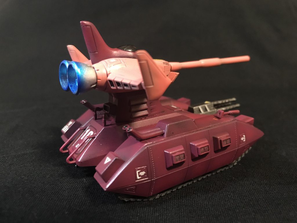 本マゼラアタックは、ガルマ・ザビが盟友シャアのために製作したものである。
とはいえ、シャアが操縦するのではなく、シャア配下の地上部隊指揮官用マゼラアタックであり、通常のマゼラアタックのチューンナップ版であった。