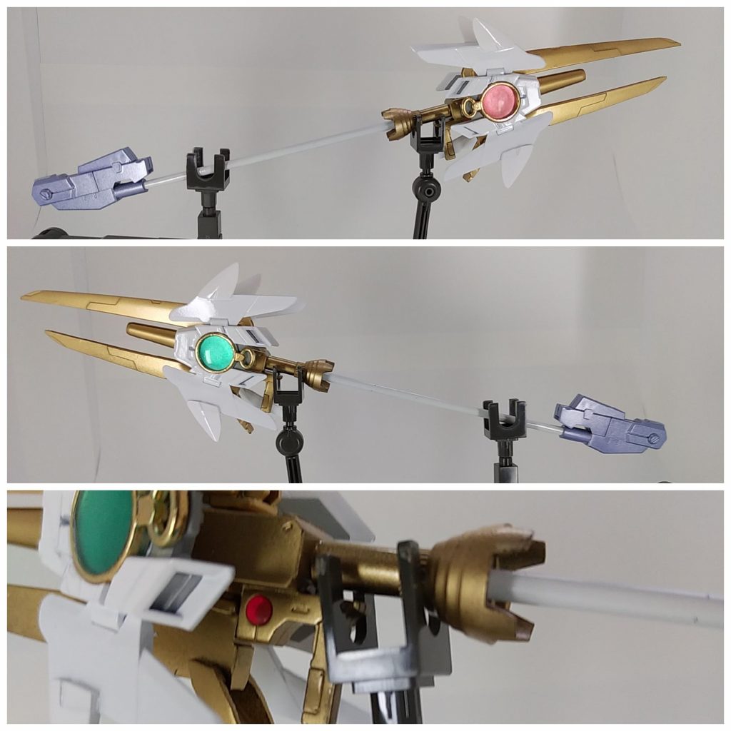 〔魔砲 ナグルファル〕別世界の白い悪魔⌒°(・∀・)°⌒が使う武器を模して作られた鉄火の魔杖。GBNでは騎士ガンダムなど魔法を使うガンプラが存在するが、この杖はGN粒子を動力源にしている。GNドライブは緑色のレンズ部分にオリジナル型太陽炉が搭載されている。柄の後端部には粒子貯蔵タンクが設置され、ビームライフル程度の出力なら連射が可能である。サポートAIも搭載されているが、言語プログラムは00のオレンジハロの物が採用されている。ちなみにトリガーの前にAIのコアがある。名前の由来はヘルが集めた死者の爪で造られた船でラグナロクの時、冥界の死者を乗せアースガルドに攻め込んだナグルファルから。最初は「魔砲少女 四号ちゃん」の「魔砲」をイメージして作り始めましたが、砲身にバエルのウィング先端部分をレールガンのように配置したら「レイジングハート」に見えてしまったので路線変更。今の形になりました。名称などに初期の名残があります。緑と赤のレンズ部分は100均のレジンアクセサリーの枠にクリアのUVレジンを流し込み、裏をメタリックレッドとメタリックグリーンで塗装しました。