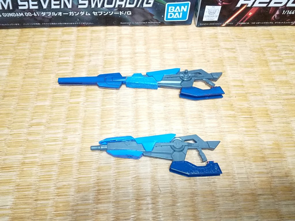 専用武装「GNバスターライフル/LR」、「GNバスターライフル/RP」
それぞれロングレンジ、ラピッドのコードを与えられており、その名の通り、長距離用と連射用にカスタマイズされたバスターライフルである。
LRはGNフィンファングを銃身に用いることで、火力と安定性を向上させた結果、長距離に対応するための武装となった。
RPは特殊なGN粒子操作装置を取り付け、一度に発射する粒子量を減少させたことで連射を可能にした。