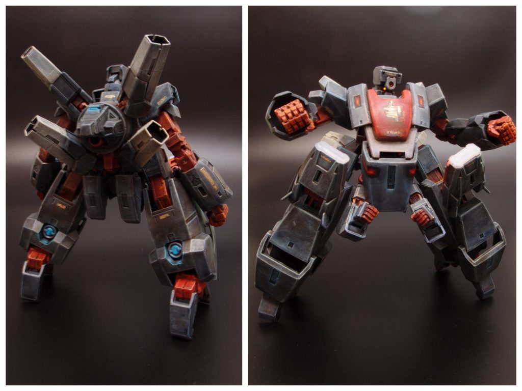 全身を覆う重装甲の下に斥力発生フィールドを備えた過剰なまでに堅牢な機体。格闘用の大型メインアームに加えて火器取り回し補助のため股間にサブアームを格納している。背部キャノン4門は機体前方へ向けることは出来ないが、無人機であるため(発射時に旋回する必要はあるが)さほど問題はない。