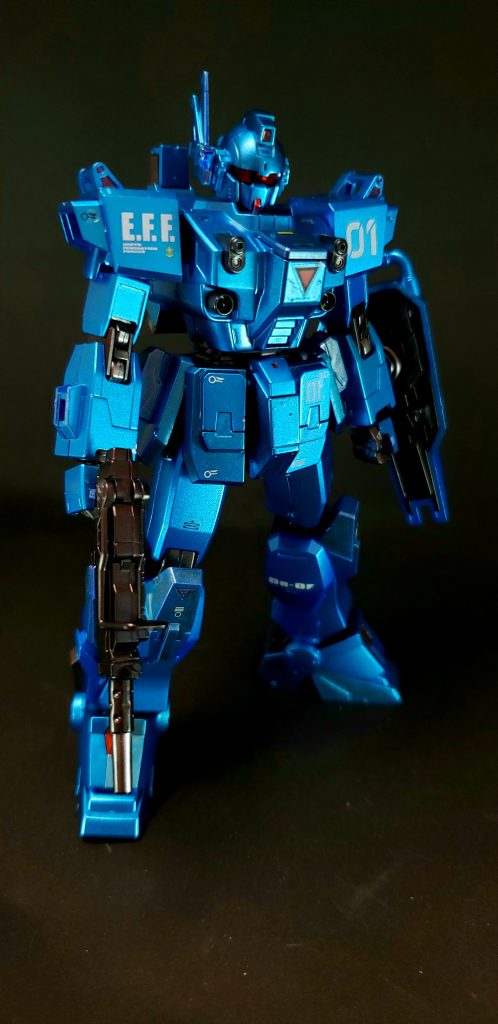 その後、機体を回収したアルフ・カムラ技術士官はEXAMシステムにリミッターをかけ、これにより1号機のEXAMシステムは通常50%しか機能しなくなる[47]。そのうえでブルーを損傷させた実験部隊である「モルモット隊」に興味を持ち、その部隊のエースであるユウ・カジマの乗機となった。