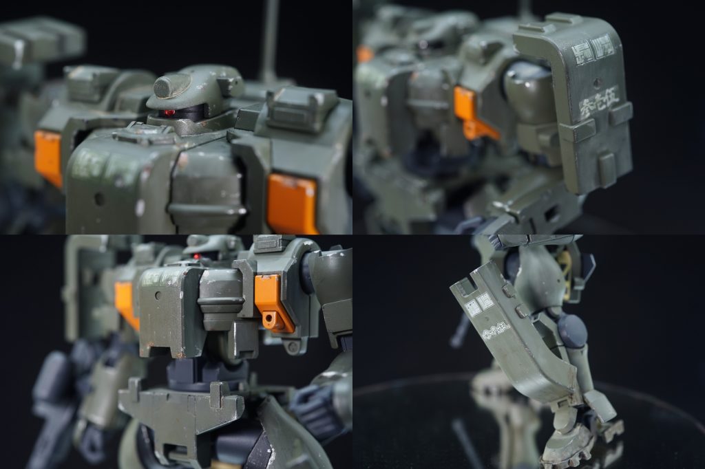 ・各部のアップ頭部はモノアイをクリアパーツに置き換えたのみ。1.6mmで開孔し、メタリックレッドのシールを貼り、1.5mmのレンズを接着して終了!腕部もほぼキットのまま。細かい穴を埋めて軽くスジボリ入れた程度です。胸部や腰部は意識的に傷を増やしています。だってこの構造だと高確率で擦れますもん…。脚部もワザと強めに汚しています。立膝で射撃するみたいなので、そちらの方は更に強めにチッピングしています。錆びていないのは今まさに剥げたから。重機の爪とかキャタピラも作業中はピカピカですもんね。