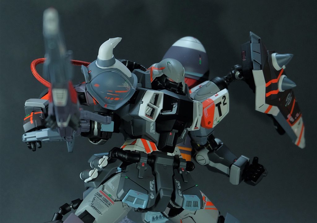 T²はTestTeamの頭文字。各種試作機の運用部隊。今回のオレンジラインは電力消費の技術試験でその部分のみVPS装甲という設定。運用データから、バッテリー駆動の機体では運用時間の制限が厳しく、現実的でないという理由から採用が見送られた。尚、ガナーウィザードに関しては遠距離射撃という性質上VPS装甲の必要性は低いというデータも同時得られたことは大きい。