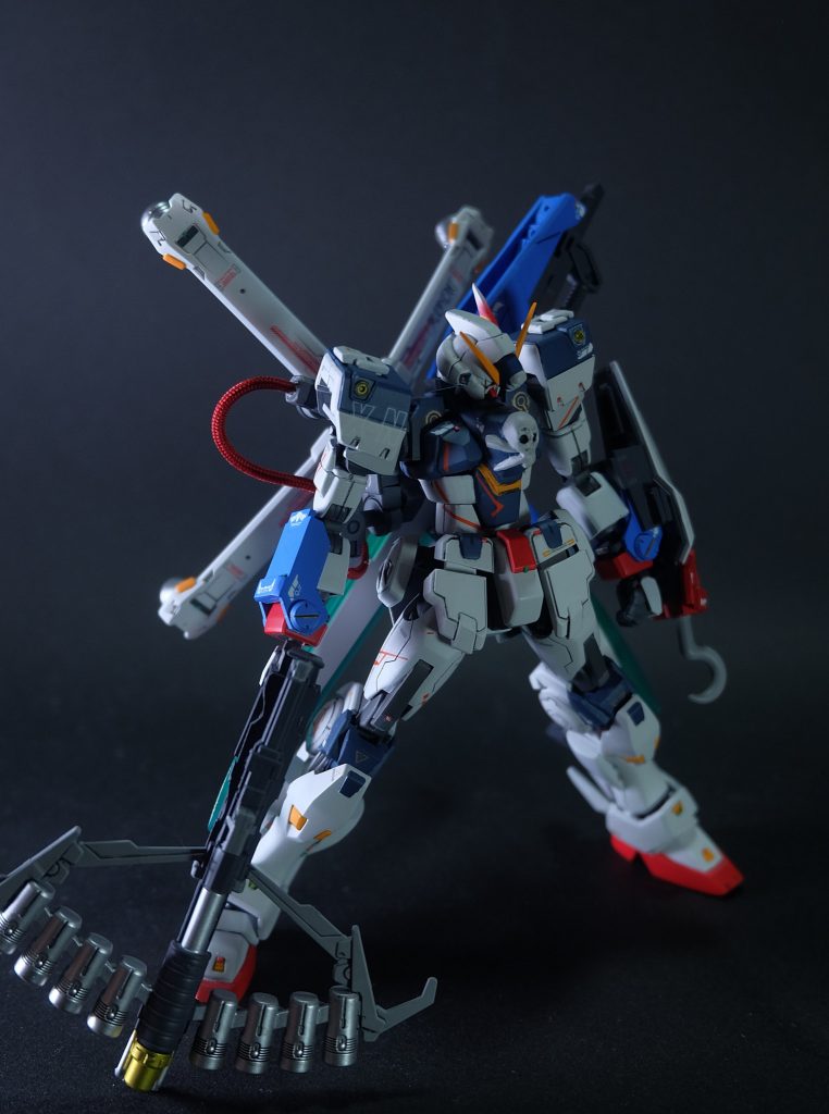 パッチワークアーマーアンテナをX1仕様に換装、CBバスターにピーコックユニットを装着しPスマッシャーへ換装。GNカタールとGNアンカーシールドを追加した重武装形態。