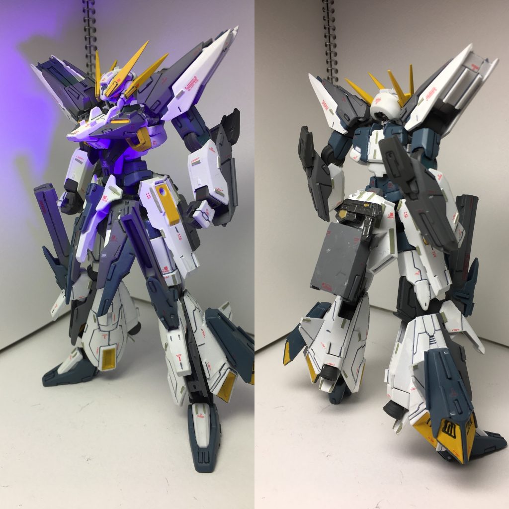 素の状態で立ち姿ツインアイは初めて蛍光塗料を使ってみました。ムラができやすい塗料で難しいですね…ブラックライトの当て方も難しい…
後ろ姿リアスカートをプラ板やパテで延長し、ネオジム磁石を3つ埋め込んでいます。これによりハルートのバインダーを接続できるようにしています。同じくネオジム磁石でリアスカートにGNピストルを装備してます。