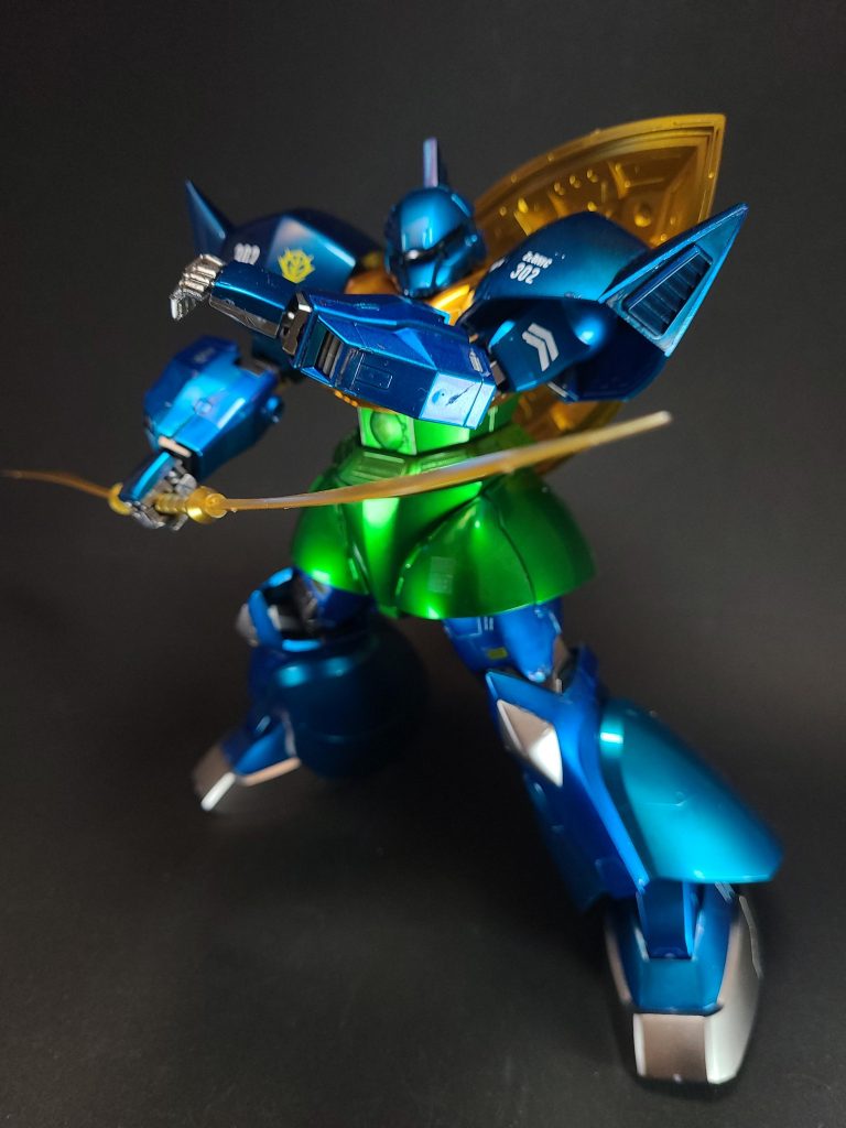 本機は、基本設計をジオニック社、スラスターなどの推進部をツィマット社（熱核反応炉も同社とする資料もある[7]）、ビーム兵器の開発をMIP社と、各分野における有力企業が請け負ったことにより、ジオン公国軍が総力を挙げて開発した機体となった。また、「統合整備計画」による規格共有化が3社の技術提携を生み、その成果が本機に活かされている