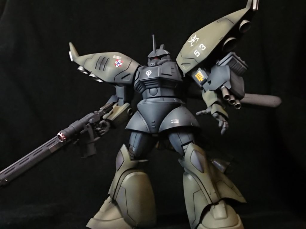 先行試作型リゲルグアクシズ内で作業・護衛・戦力として使われていたゲルググ。キュベレイの設計が完成した段階で、それを参考にゲルググの改修型が複数開発され、リゲルグの先行試作機も少数製作された。正式採用機に比べてバーニアの量も少なくゲルググとの差異は小さい。本機は正式採用機仕様とノーマルタイプの過渡期にあたる仕様となっており、ゲルググタイプで構成された小隊の指揮官機として運用されている。