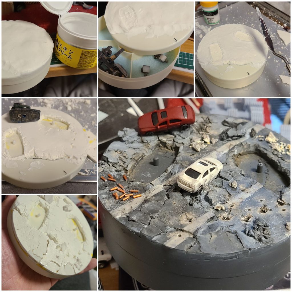 台座は100均で手に入るアクセサリーケースをベースに、付け替え用のパーツを収納しておくことが可能です。蓋の上に、石粉粘土でベースを作り、スキンクリームを塗った足をスタンプしてめり込みを付け、更にアスファルトの地表はモデリングペーストで表現しています。アクセントに建築模型に使うような安いミニカーをあしらいました。散らばる薬莢は、カッパーに塗ったプラ棒の筒切りです。