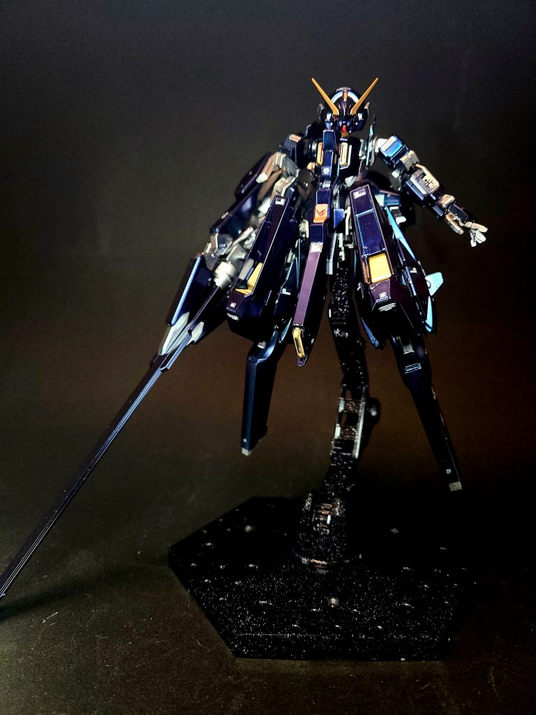 『ティターンズの旗のもとに』のフォト・ストーリーおよび小説版では、グリプス戦役終盤の宇宙世紀0088年1月、T3部隊の母艦「アスワン」に試作機1機がキハールII中間形態のような状態で搬入される。2月、エリアルド・ハンター中尉がテスト・パイロットに任命され、シミュレーターで訓練を続ける。同月のコロニー・レーザー争奪戦のさなか、アスワンはティターンズ司令部から本機の実戦投入を命じられる。しかし、すでに戦争の勝敗は決しており、これ以上の損害はどの陣営にとっても無意味な中、「ガンダム」である本機が出撃すればティターンズは勢力を盛り返し、戦いは長引いてしまう。そのため、アスワン艦長オットー・ペデルセン大佐はエリアルドに、出撃後は戦線に参加せずに本機を破壊することを命ずる