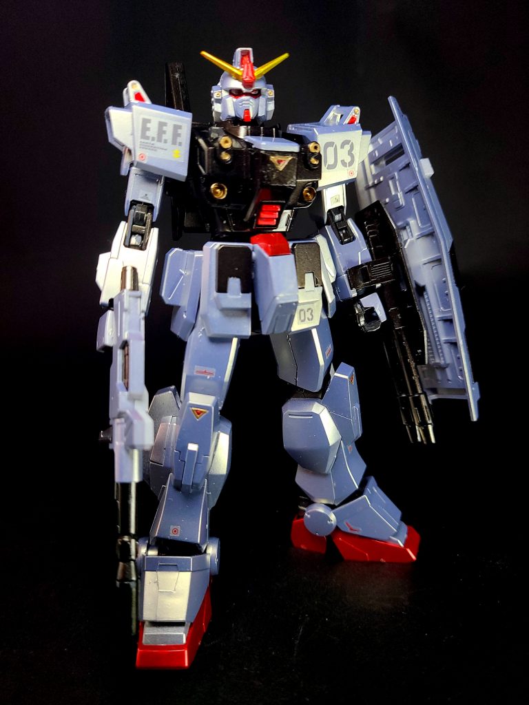 機体にはクルスト・モーゼスが亡命の折に持ち寄った「EXAMシステム」が搭載されている。機体色はクルスト個人の趣味により青く塗装されているとされる。陸戦型ガンダムをベースに大幅な改修が加えられている。ジェネレーター出力の強化に加え、各関節部にマグネット・コーティングを試験的に施し運動性を向上。火力面においても、陸戦型ガンダムの標準装備である胸部機関砲を1門から2門に増備し、腹部両脇には有線式ミサイルを追加装備するなど原型機を大きく上回っている[41]。なお、陸戦型ガンダムをベースとしたために基本仕様は地上用の機体となるが、バックパックの換装によって宇宙戦も可能としている