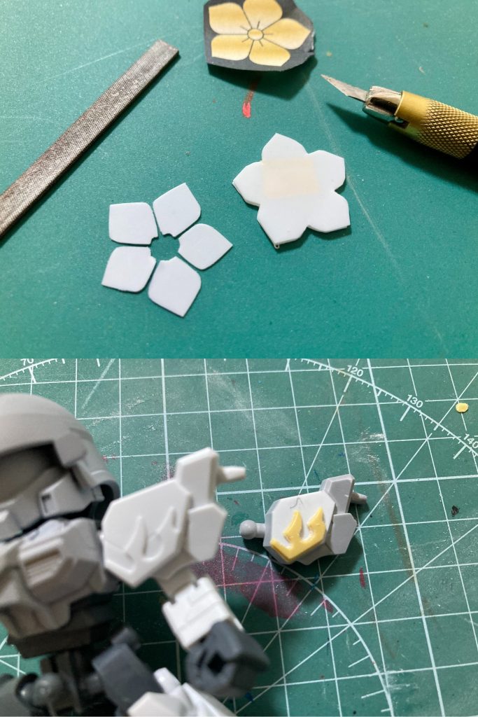 胴体はジェガンと同じCCA世界観の連邦系MS演者である関羽雲長νガンダムをベースに、BB戦士ファーストガンダム大将軍の鎧甲冑パーツ等を組み合わせました。A字状のアムロ専用機エンブレムは削り落として平面にし、通常の肩装飾をおゆまるで型取ってエポパテで造型して貼り付けたり、各部ジョイントや可動の調整など細々とした加工を随所に施しています。対比叡山焼き討ち兵装は、ジェガンの強化バリエーションであるスタークジェガン風に換装させる形で、光秀の戦歴に因んで設定しました。スタークジェガンの特徴的な肩部三連装ミサイルポッドはじめ先月再販されたHGBCガンプラバトルアームアームズ＆パワードアームズパワーダーの部品を利用しています。アームの伸び巡らされる感じと肩のファーストガンダム大将軍のデカいシールドの印象で『機動戦士ガンダム サンダーボルト』に登場する連邦軍MSっぽい雰囲気にもなったかなと思います。