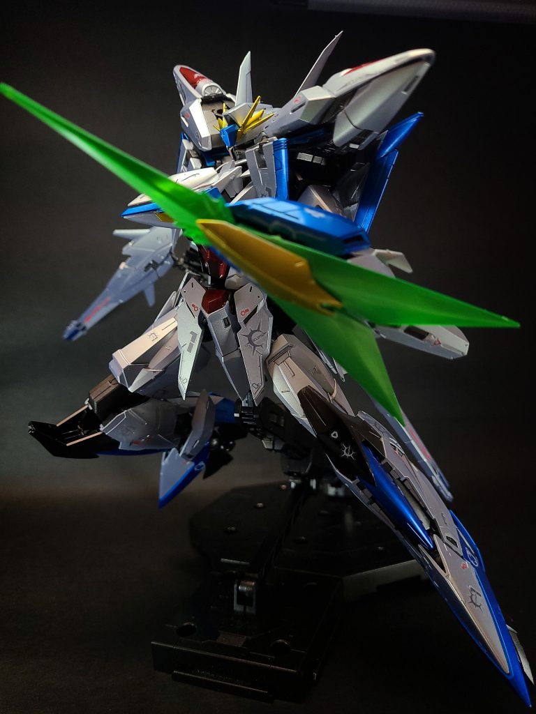 この機体が開発された経緯として、オーブは中立の島国として領空を限られた軍事リソースで守り切る必要性があり、「敵先制攻撃の本土到達前の迎撃」の為の航空戦力の増強がコズミック・イラ60年代から検討が続けられて来た事が挙げられる[1]。それと同時に、「敵国が攻撃姿勢を整えた段階で攻撃を開始する、超長距離、超高速度、超高高度からの敵基地攻撃能力」が強調され、その運用方針には「敵国への核攻撃」の可能性すらも含まれていた。それは、オーブの中立国としての理念を根底から揺るがす思考であったが、「いかなる国とも結ばない」を国是とした方針を守る為に研究開発が進められた。機体名称であり、開発計画名でもある「エクリプス」は「日蝕」を意味し、オーブの国家シンボルである太陽が陰る事から、「もし表沙汰になればオーブを闇に落とす者」というニュアンスが込められている。従来は、MSではなく戦略爆撃機として計画されたものであり、その存在が明らかになれば、オーブの基本理念すら失墜するとして最高機密の一つに指定された。それでも、長らく仮想戦略の領域で研究が進められていたが、C.E.70年以降の動乱とオーブ解放作戦により主権を奪われ、実質的に占領下に置かれるという国家的屈辱を味わった事で、本格的な開発が行われる。開発時のオーブは連合による支配下にあった為、表沙汰には「救助隊の特殊機体」の名目かつ、五氏族のキオウ家の管理下で、軍部ではなく外務省の管轄で行うという念の入ようで秘匿されていた。