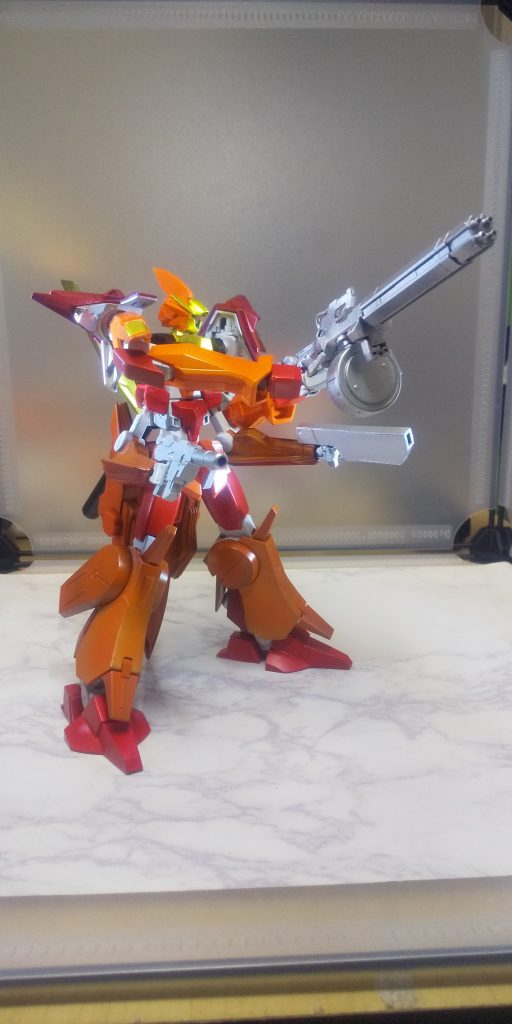 機体名:ガンダム・オラトリオ武装:GNメガビームガトリング GNボックスビームライフルGNショットビームピストル GNオーバースピアおよび多数のモビルスーツ用手持ち兵装以前会敵した正体不明のモビルスーツに対抗するために建造された新型。機体自体には小型化された新型GNドライヴを5基搭載。武装を外付けの物に統一することで継戦能力を最大まで高めることに成功した。
