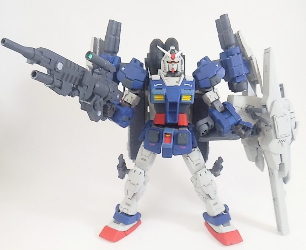 重装形態です。大型のシールドキャノン、両肩の二連装キャノン、ビークル用のバックパックを装備させます。それぞれ30MMとガンプラのジャンクパーツによるミキシングで作りました。