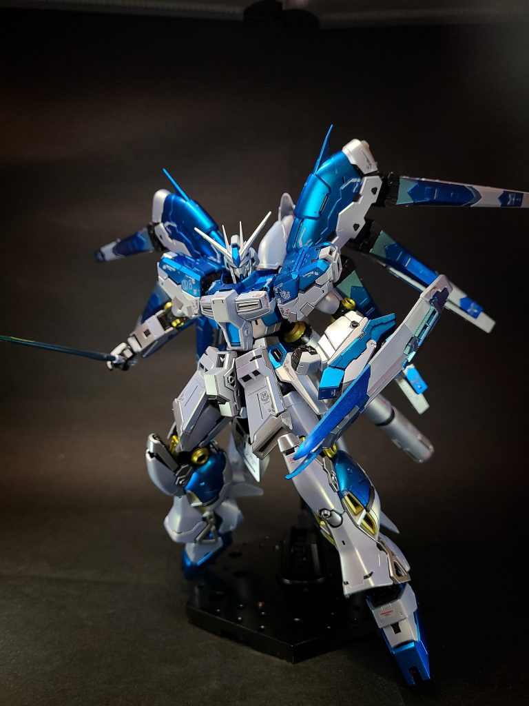 νガンダムの改良発展型とする設定『CCA-MSV (逆襲のシャア・モビルスーツ・バリエーション)』を出自とし、Hi-νガンダムをνガンダムの改良発展機（完成型）とする設定。形式番号はRX-93-ν2 (資料によりRX-93-ν-2ともされる)。映画『逆襲のシャア』にて、「RX-93 νガンダム」は実質3ヶ月という短期間で設計・建造され、アムロによりνガンダムはテストを行わず実戦投入された。その為、νガンダムはまだまだ改良・発展の余地を残しており、νガンダムがロンド・ベル隊に納入された後、アナハイム・エレクトロニクス社は独自に改修計画を実施、新機種の開発に着手した。これには「Hi-νガンダム」のコードネームが付与され、設計の見直しと各種アビオニクスの更新、武装の追加を経て完成した。基礎設計の修正にはアムロ・レイも参加したとされる[54]。急造されたνガンダムと違い、十分なテストを重ねて完成された改良発展機[53]。バックパックに設置されたファンネルラックに左右3基づつフィン・ファンネルを配置することにより、重心のバランスが改善した。フィン・ファンネルは回収と再マウントが可能になり、エネルギーの充填により稼働時間が延長された。プロペラントタンクの増設により、本体の稼働時間も向上しており、サイコミュ関連の熟成も進められ、完成度がより高まっている[51]。大出力火器であるハイパー・メガ・バズーカ・ランチャーも携行できる。『Gジェネレーション』、『スーパーロボット大戦』、『ギレンの野望』シリーズ等、多くのTVゲーム媒体でこの設定が採用されている。『FW GUNDAM CONVERGE ♯5』では『CCA-MSV』の機体として、Ver.ka (後述)のデザインで商品化された。