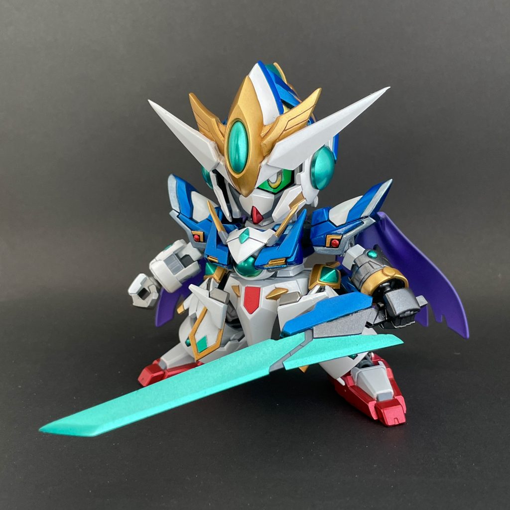 「私が…ガンダム?!」愛ゆえに、ガンダム族として覚醒した姿。その姿はあの少年のガンダムに酷似していた…転生した時から手にしていた一振りの大剣GNタチを装備。
