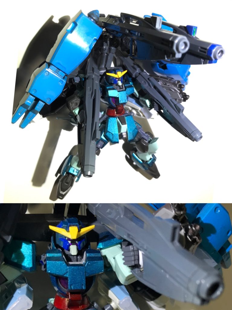 上部背中には推進器と一体化したサブアームユニットが増設されており、4本あるアームの内中央の2本は粒子ビームを発射する様に調整したNGNバズーカを装備。左右両端のアームにはELS戦役中、ヴェーダで何者かが製造したガンダムラファエルの建造データを盗yいや流用したGNクローを搭載する。このGNクローではビッグキャノンの発射機構がオミットされ代わりにアルヴァトーレのGNファングと同様のAI制御機能とGNフィールド発生機能が搭載された。不足した火力は2挺のNGNバズーカで粒子ビーム砲を収束して発射する事でカバーしている。(1枚目の写真)