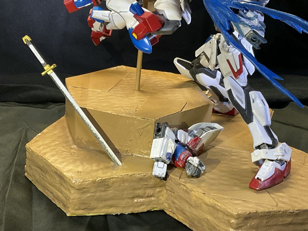 戦いの中で取り落とした刀と、それぞれの片腕。雑エモポイント。