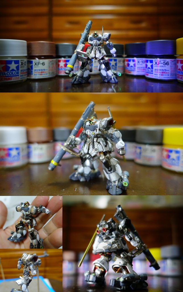 ↑「スカート付き」をスカートめくりの背徳感???それはさておき、500円とはいえ、その密度・難易度は老眼も相まってかなりのもの。拡大鏡と老眼鏡のハイブリッドでも難儀したが、楽しかった。ダイソーのラッカースプレーシルバーと、タミヤ水性アクリルカラーでの筆塗りで、アップにはとても耐えられない。けれどガンダムマーカー蛍光グリーン+ブラックライトでモノアイを光らせたら、白く塗ったボディーが紫と黒のコンビネーションになり、期せずしてドム色になった(笑)。起動するとボディーカラーも変化するとは、トランザムも実装?手軽に手が出せる価格で、でもガッツリ楽しめるアーティファクト。少年時代数百円を握りしめながらガンプラを買いに走ったあの頃がフラッシュバックするアラフィフ世代はまんまと餌食に(笑)おっさんホイホイかよ。「やるな!バンダイ!」