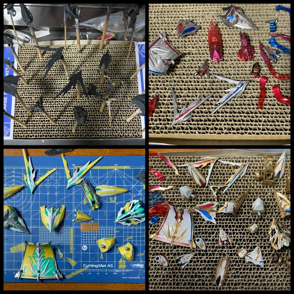 塗装主に水性ホビーカラーを使用し、以下の手順で塗装しました。1. 下地としてダークグレー2. シルバー3. 白、金部分をマスキングして、クリアカラーの赤、青、紫(赤+青)でキャンディ塗装4.マスキングを剥がし、赤、青、紫部分をマスクして白(ガンダムホワイト+ホワイト)5.白部分をマスキングしてゴールド6. 細かいゴールドを筆塗り7. マスキングを剥がして全体にアクリジョン光沢クリア8. ウェザリングカラーでスミ入れ9. 全体にビスマスパール(うみんちゅパール/ラッカー系) 10. 全体に水性ホビーカラー光沢クリアクリアパーツも部分的にシルバーを吹いてキャンディ塗装してます。今回はじめてビスマスパールを作品に使用してみました。噂通りの輝きで、やはりマイカ系パールではなかなかここまで行かないですね。水性系の塗料で使えないのが残念です。白と金の部分はたっぷりとパールを乗せるといいのですが、同じ量を赤や青のクリアパーツに乗せると白くなり過ぎてしまいました。フワッとで十分でした。なのでちょっとクリアパーツの白くなり過ぎてしまった部分は綿棒に薄め液をつけてパールを落としました😅