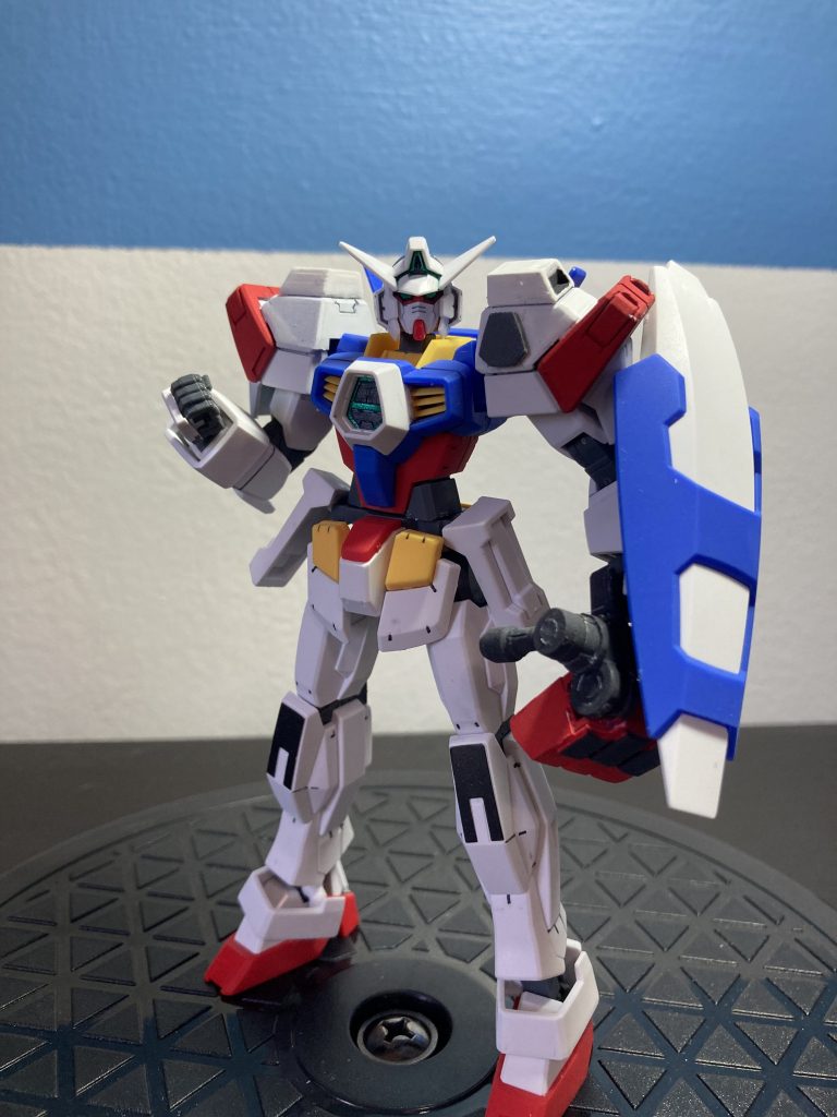 Similar to the Half Sparrow, you can also eject the armor to form the AGE-1 Half Titus. This form uses the Titan Fist Grenade Launcher and is now converted to Fist Mode as the primary weapon. In addition, it uses a shield and has a beam tackle mechanism hidden in the shoulder armor.  