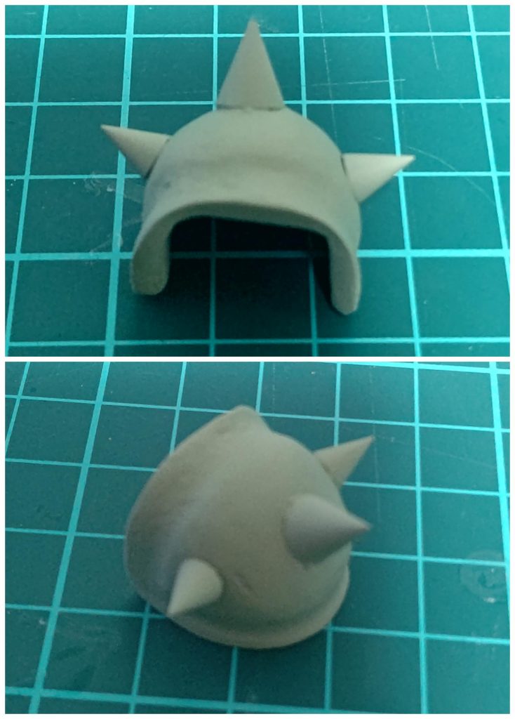 こちらは、ざっくり元々の肩アーマーを囲う感じにプラ板で形をつくり、接続軸をランナープラ棒で作成その上をエポパテで覆いある程度整形その後は金属ヤスリやらでガリガリ整形スパイク部分はコトブキヤのSMGスパイクを瞬着で固定ヤスリが足らなかったか、近くで見ると凸凹が目立つ…