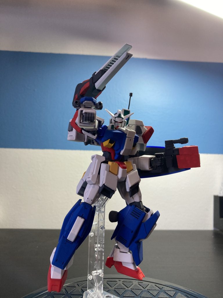 In terms of weapons, the Perfect AGE-1 uses a Twin DODS Beam Gun on the right arm, a Titan Fist Grenade Launcher and Shield on the left arm, and a Glasstron Cannon on the right shoulder. box art of MG Perfect Gundam!) 