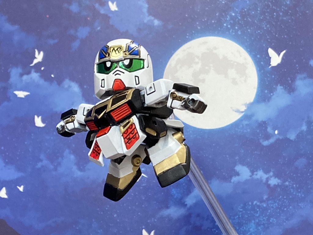 足は後ろにも上がります。背景は百均の背景シート。種類が豊富でジオラマ代わりに使えます。