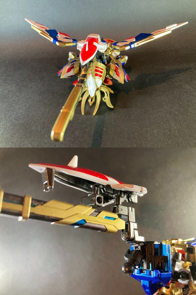 変形時シルエットは、機体自身はうつ伏せに倒れるだけなのでシンプルですが、その分バスターライフルとシールドの主張と印象がかなり強いため、その部分の再現に説得力を持たせられるようライフルは大太刀の鞘で代用しシールドはBB戦士のパーツを追加装備として付属させました。接続はボールデンアームアームズ・ガンプラバトルアームズ等の小部品を組み合わせて装着しています。U字ジョイントで首根っこを掴ませる手法は、クレオパトラキュベレイ付属のダークマスクの接続方法を参考にしました。